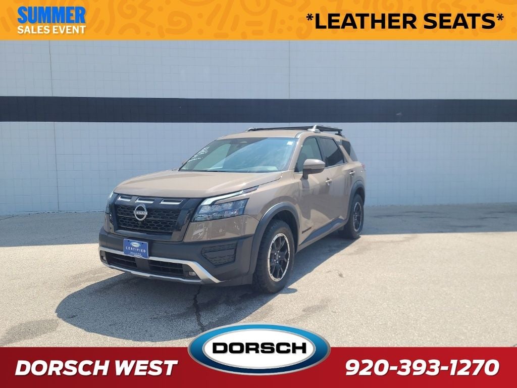 2023 Nissan Pathfinder Rock Creek in Baja Storm — front three-quarter view